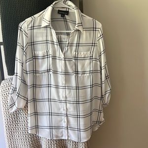 Woman’s white and black blouse